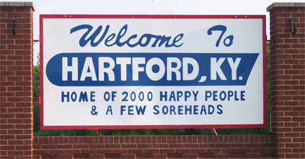 Hartford, Kentucky Welcome sign.  "Welcome to Hartford, KY. Home of 2000 happy people & a few soreheads."